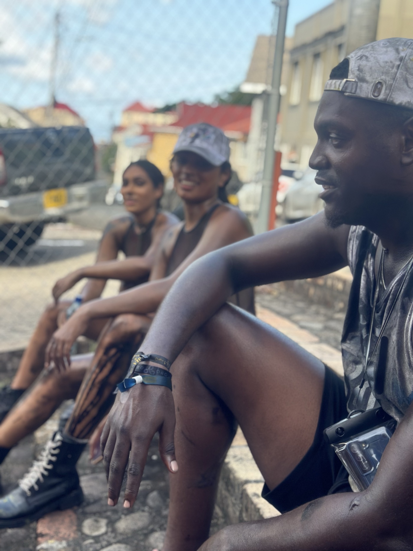 A Jab Jab masquerader covered in black oil during Spicemas J'ouvert in Grenada