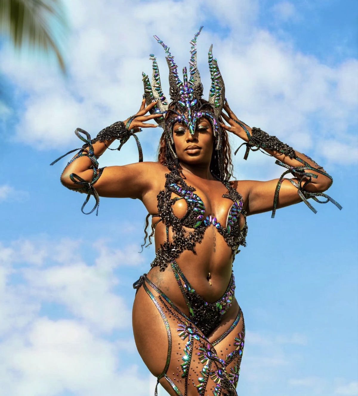 Masquerader in a jewelled Spicemas costume and horned headpiece in Grenada with Carnival Glam Hub makeup and photoshoot